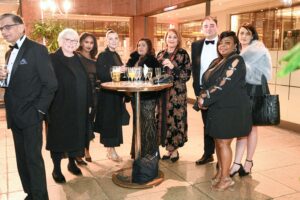 Hillingdon Business Awards 2025. A mixed group is standing at a tall table. They are looking at the camera and smiling.